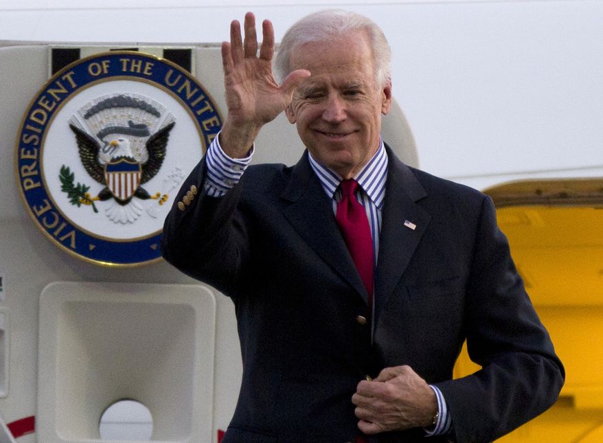 **FILE** Vice President Joseph R. Biden Jr. waves as he arrives to Benito Juarez International airport in Mexico City on Nov. 30, 2012. (Associated Press)
