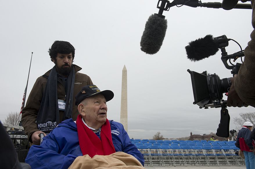 Harry Patch, who served in the Pacific with the U.S. Navy during World War II, is interviewed at the World War II Memorial in Washington, D.C. on Friday, Dec. 7, 2012 before a National Pearl Harbor Remembrance Day ceremony. Vipul Tripathi with Reingold communications accompanied Mr. Patch, who was one of several veterans who came for the ceremony. (Barbara L. Salisbury/The Washington Times)