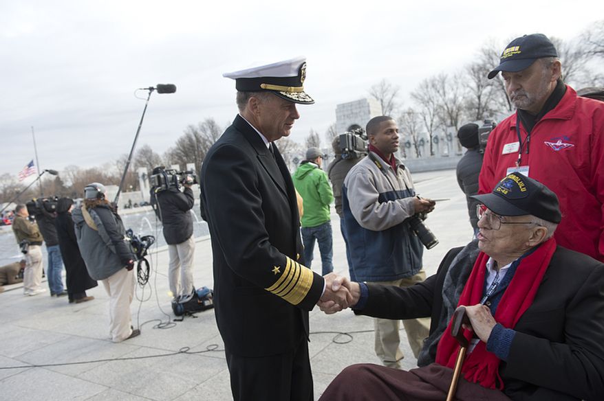 Admiral James Winnefeld, vice chairman of the Joint Chiefs of Staff, shakes hands with Jim Hardwick of Dallas, Texas, who served in the Pacific in the U.S. Navy during World War II. The admiral thanked Mr. Hardwick for his service following a wreath-laying ceremony at the National Pearl Harbor Remembrance Day Friday, Dec. 7, 2012 at the National World War II Memorial in Washington, D.C. (Barbara L. Salisbury/The Washington Times)