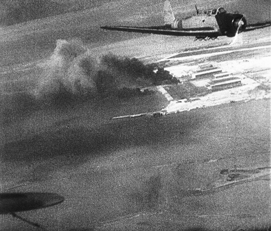 Japanese planes over Hawaii during the attack on Pearl Harbor, Dec. 7, 1941, are shown in this scene from a Japanese newsreel. The film was obtained by the U.S. War Department and released to U.S. newsreels. (AP Photo/U.S. War Department)