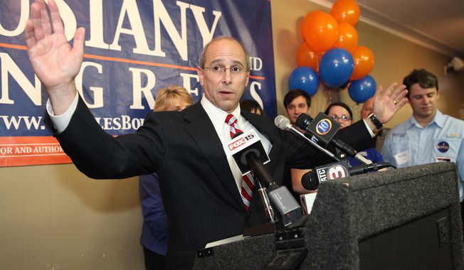 **FILE** Rep. Charles W. Boustany Jr. reacts after receiving news of his election win to Louisiana&#x27;s 3rd Congressional District seat while his wife, Bridget, and family Ashley, Jacques, Caree and Erik look on, on Dec. 8, 2012, in Lafayette, La. (Associated Press/The Advertiser)