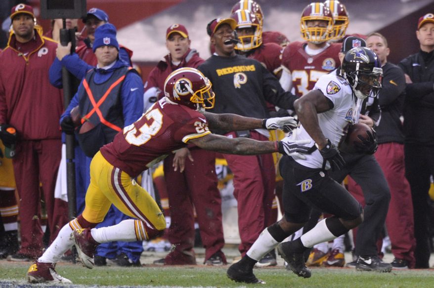 Baltimore Ravens wide receiver Anquan Boldin (81) breaks from Washington Redskins cornerback DeAngelo Hall (23) and runs to the 7 yard line setting up a fourth quarter touchdown at FedEx Field, Landover, Md., Dec. 9, 2012. (Preston Keres/Special to The Washington Times)