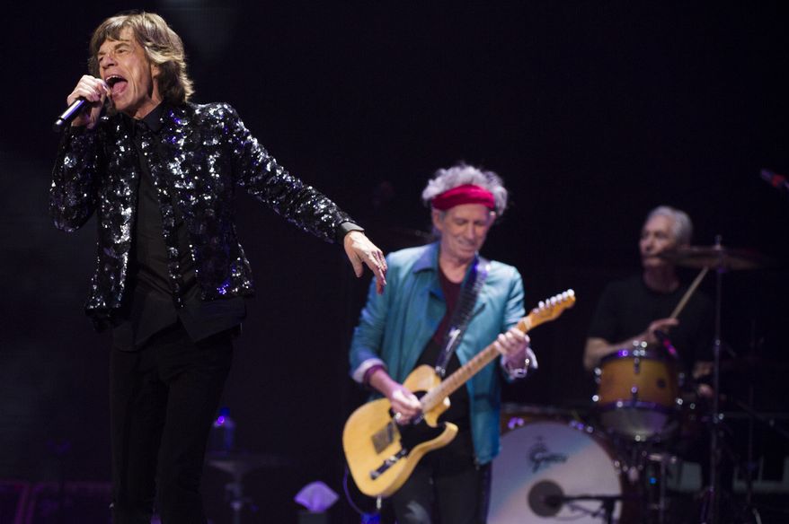 Mick Jagger (from left), Keith Richards and Charlie Watts of the Rolling Stones perform in concert on Saturday, Dec. 8, 2012, in the New York borough of Brooklyn. (Charles Sykes/Invision/AP)