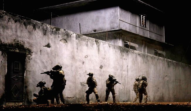 Navy SEALs raid Osama Bin Laden’s compound in “Zero Dark Thirty,” directed by Kathryn Bigelow. The film is among the American Film Institute’s Top 10 movies of the year announced Monday. (Columbia Pictures Industries via Associated Press)