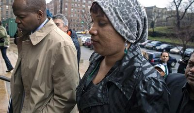 Nafissatou Diallo, who claimes she was sexually assaulted by former International Monetary Fund leader Dominique Strauss-Kahn, arrives at a courthouse in the Bronx borough of New York on Monday, Dec. 10, 2012. (AP Photo/Craig Ruttle)