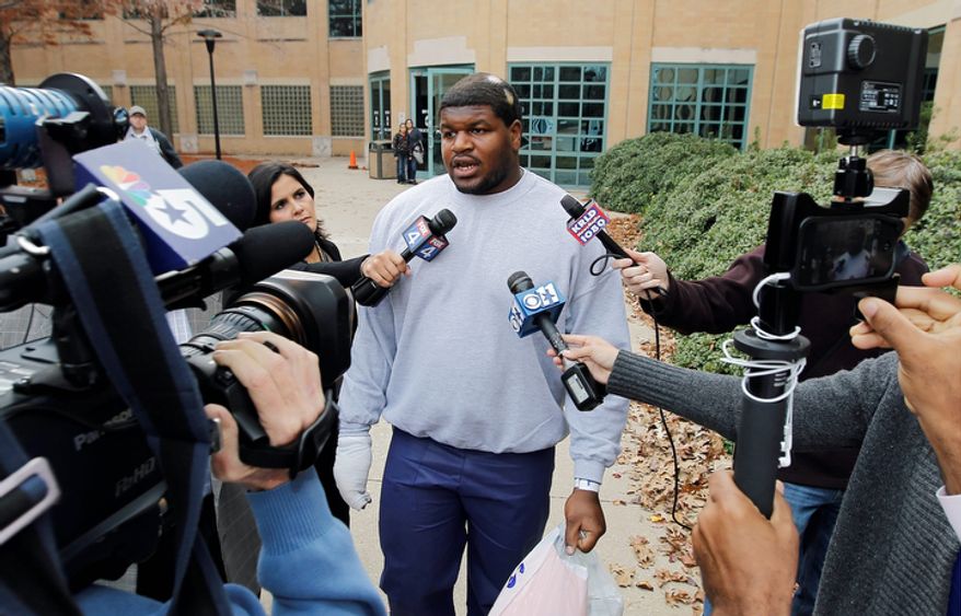 Dallas Cowboys nose tackle Joshua Brent talks to the media after his release from the Irving City Jail after posting a $500,000 bond on Dec. 9, 2012. Brent is charged with intoxication manslaughter after a crash earlier that morning resulted in the death of his passenger, teammate Jerry Brown. (Associated Press/Dallas Morning News)
