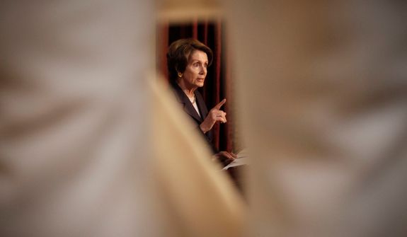 **FILE** House Minority Leader Nancy Pelosi, California Democrat, is framed through the marble statue of Lewis Cass, representing Michigan, by Daniel Chester French, as she speaks during a news conference in Statuary Hall on Capitol Hill in Washington on Dec. 7, 2012. (Associated Press)