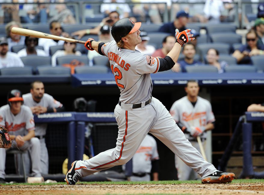 FILE - In this Sept. 2, 2012, file photo, Baltimore Orioles' Mark Reynolds hits a three-run home run during a baseball game against the New York Yankees in New York. A person familiar with the negotiations said on Sunday, Dec. 9, 2012, that the Cleveland Indians have agreed to a one-year contract with free-agent slugger Mark Reynolds. The person spoke on condition of anonymity because the agreement is pending a physical. (AP Photo/Kathy Kmonicek, File)