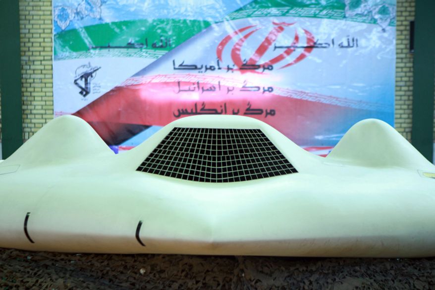 This photo released Dec. 8, 2011, by the Iranian Revolutionary Guards and taken at an undisclosed location claims to show a U.S. RQ-170 Sentinel drone that Tehran said its forces downed earlier in the week. (Associated Press/Sepahnews)