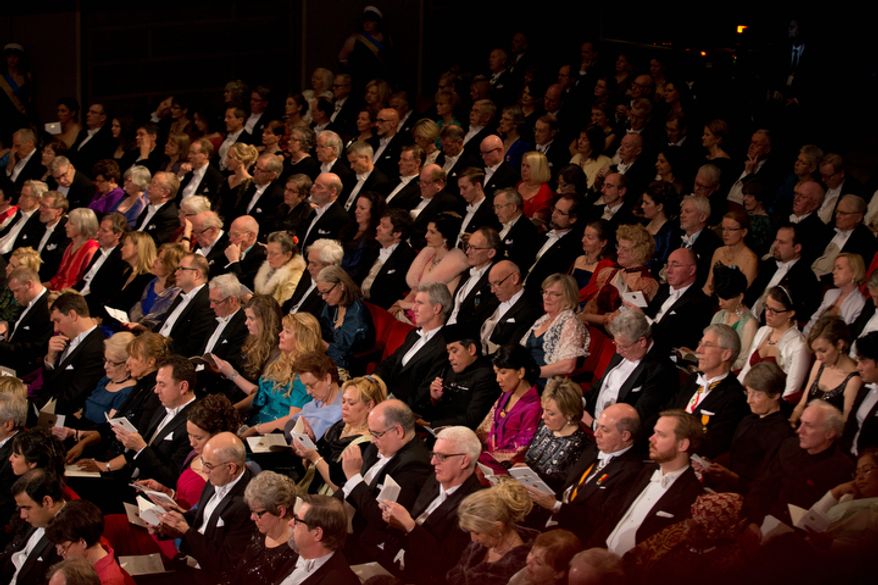 The audience listen during the Nobel Prize award ceremony at the Stockholm Concert Hall in Stockholm on Dec. 10, 2012. The Nobel awards are always awarded on Dec. 10, the anniversary of Alfred Nobel's death in 1896. (Associated Press)