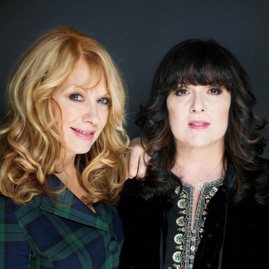 FILE - This Oct. 1, 2012 file photo shows sisters Ann, left, and Nancy Wilson from Heart in New York. The eclectic group of rockers Rush and Heart, rappers Public Enemy, songwriter Randy Newman, "Queen of Disco" Donna Summer and bluesman Albert King will be inducted into the Rock and Roll Hall of Fame next April in Los Angeles. The inductees were announced Tuesday by 2012 inductee Flea of The Red Hot Chili Peppers at a news conference in Los Angeles. (Photo by Victoria Will/Invision/AP Images)