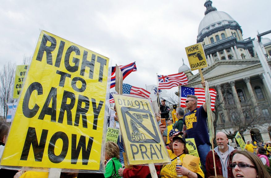 Gun owners and supporters participate in an Illinois Gun Owners Lobby Day rally at the Capitol in Springfield in March 2012. (Associated Press)
