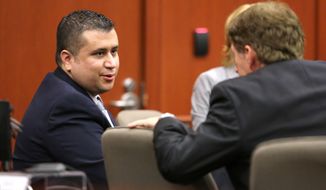 ** FILE ** George Zimmerman (left) talks with defense counsel Mark O&#39;Mara during a court hearing at the Seminole County Courthouse on Tuesday, Dec. 11, 2012, in Sanford, Fla. (AP Photo/Orlando Sentinel, Joe Burbank, Pool)