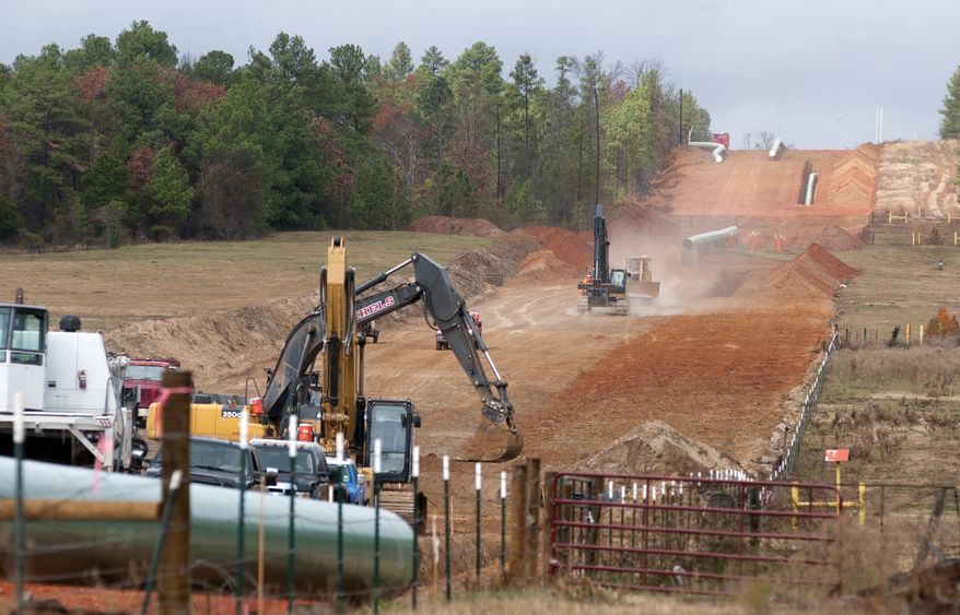 **FILE** Crews work on construction of the TransCanada Keystone XL Pipeline near County Road 363 and County Road 357, east of Winona, Texas, on Dec. 3, 2012. (Associated Press/The Tyler Morning Telegraph)