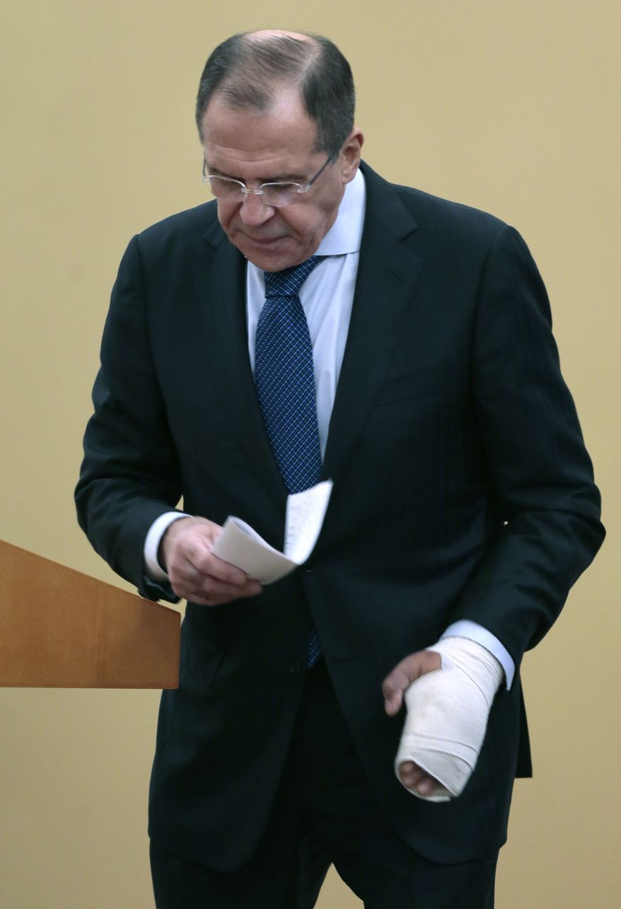 Russian Foreign Minister Sergey Lavrov walks Dec. 10, 2012, after speaking at the International Parliamentary Forum in Moscow, Russia. (Associated Press)