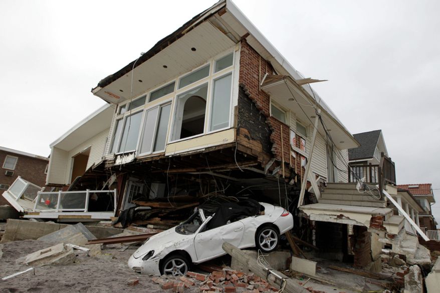 A beachside house deemed uninhabitable by the New York City Department of Buildings is left in ruins in the Belle Harbor neighborhood of the Rockaways in New York on Monday, Nov. 19, 2012. (AP Photo/Kathy Willens)