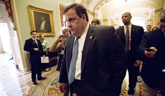 ** FILE ** New Jersey Gov. Chris Christie walks to a meeting on Capitol Hill in Washington on Thursday, Dec. 6, 2012, to talk about aid to help his state recover from superstorm Sandy. President Obama is expected to ask Congress for about $50 billion in additional emergency assistance. (AP Photo/J. Scott Applewhite)