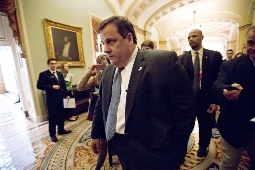 ** FILE ** New Jersey Gov. Chris Christie walks to a meeting on Capitol Hill in Washington on Thursday, Dec. 6, 2012, to talk about aid to help his state recover from superstorm Sandy. President Obama is expected to ask Congress for about $50 billion in additional emergency assistance. (AP Photo/J. Scott Applewhite)