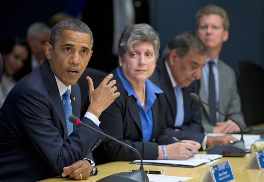 President Obama, accompanied by members of his Cabinet, speaks about superstorm Sandy at the Federal Emergency Management Agency headquarters in Washington on Wednesday, Oct. 31, 2012. With him are (from second from the left) Homeland Security Secretary Janet Napolitano, Defense Secretary Leon E. Panetta and Housing and Urban Development Secretary Shaun Donovan. (AP Photo/Carolyn Kaster)