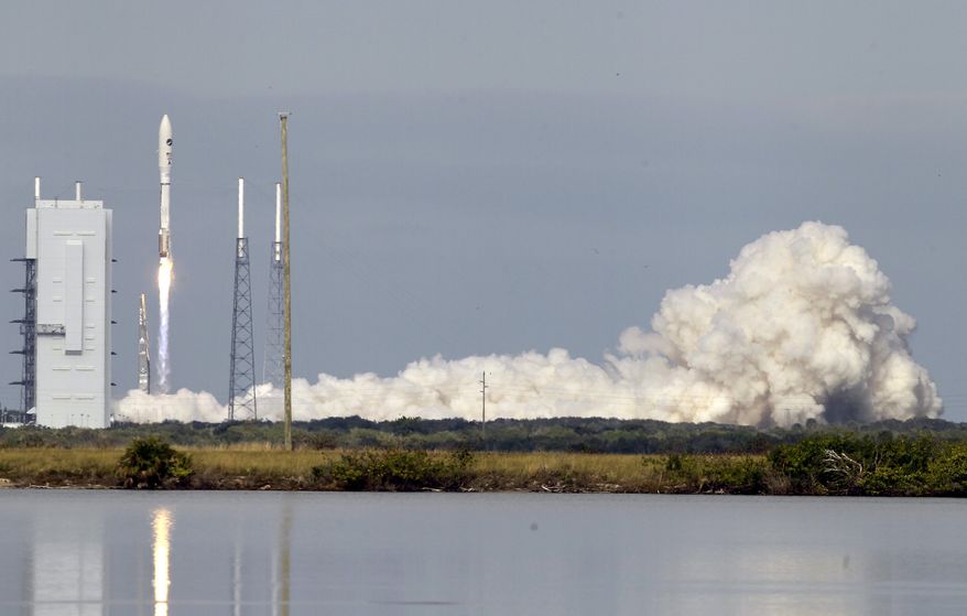 ** FILE ** A United Launch Alliance Atlas V rocket carrying an X-37B experimental robotic space plane lifts off from Launch Complex 41 at the Cape Canaveral Air Force Station on Tuesday, Dec. 11, 2012, in Cape Canaveral, Fla. Air Force officials said the unmanned space plane, which resembles a miniature space shuttle, provides a way to test technologies in space. (AP Photo/John Raoux)