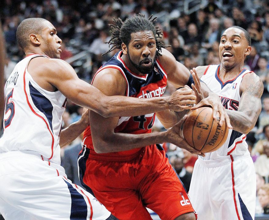 associated press
Nene posted his first double-double of the season Tuesday night, scoring 10 points and grabbing 10 rebounds in a 77-70 victory New Orleans.