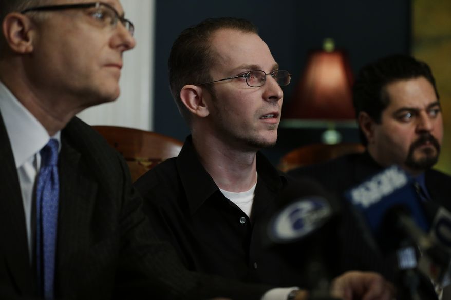 Plaintiff Melvin Novak (center), flanked by attorneys Stewart J. Eisenberg (left) and Dino Privitera, speaks during a news conference on Wednesday, Dec. 12, 2012, in Philadelphia. Mr. Novak has filed a sexual abuse lawsuit against the Boy Scouts of America, the Church of Jesus Christ of Latter-day Saints and a former scoutmaster convicted of molesting him when Mr. Novak was 15. (AP Photo/Matt Rourke)