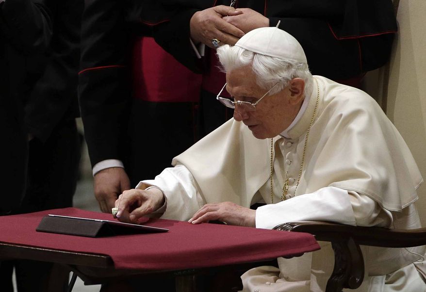 Pope Benedict XVI pushes a button on a tablet at the Vatican last December. In perhaps the most drawn out Twitter launch ever, Pope Benedict XVI pushed the button on a tablet brought to him at the end of his general audience Wednesday. It read: "Dear friends, I am pleased to get in touch with you through Twitter. Thank you for your generous response. I bless all of you from my heart." (AP Photo/Gregorio Borgia)