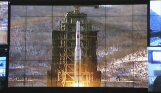 In this image made from video, displays show the Unha-3 rocket launch at North Korea&#x27;s space agency&#x27;s General Launch Command Center on the outskirts of Pyongyang, Wednesday, Dec. 12, 2012. (AP Photo via APTN)

