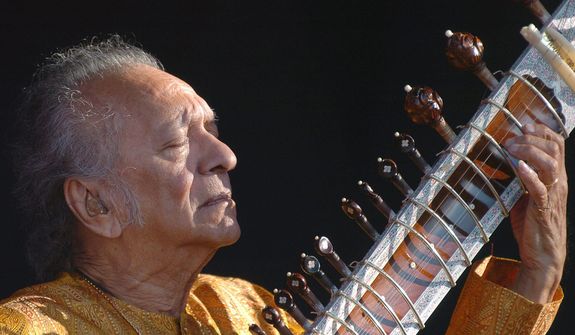 **FILE** Indian musician Ravi Shankar performs during the opening day of the Paleo Festival in Nyon, Switzerland, on July 19, 2005. (Associated Press/Keystone, Sandro Campardo)