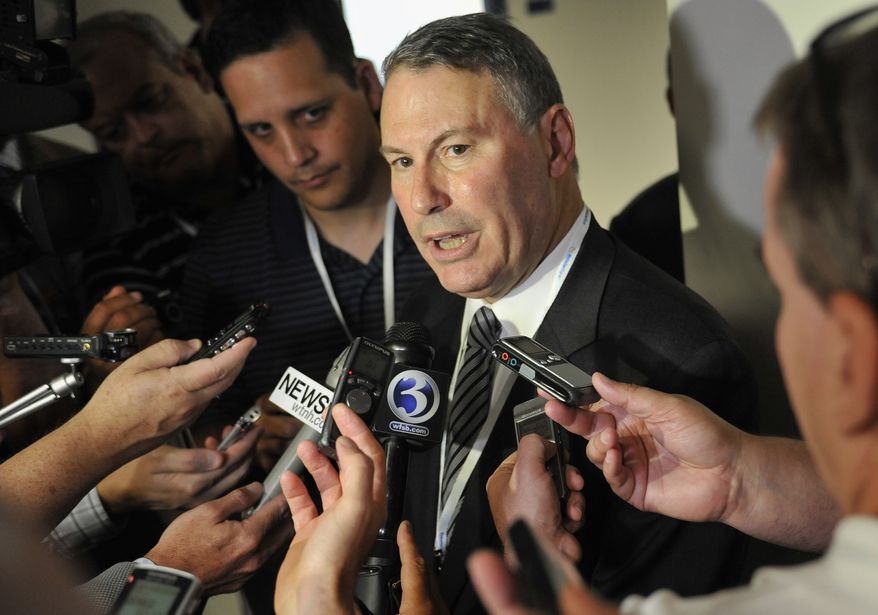 FILE - This Aug. 30, 2012 file photo shows Big East commissioner Mike Aresco answering questions from the media before an NCAA college football game between Connecticut and Massachusetts at Rentschler Field in East Hartford, Conn. Aresco is working with the officials from the conference's seven nonfootball members to keep the rebuilding league from splitting apart. A person familiar with the situation tells The Associated Press that Aresco and officials from those seven Catholic schools held a conference call Thursday, Dec. 13, 2012 to discuss the future of the league. (AP Photo/Jessica Hill, File)