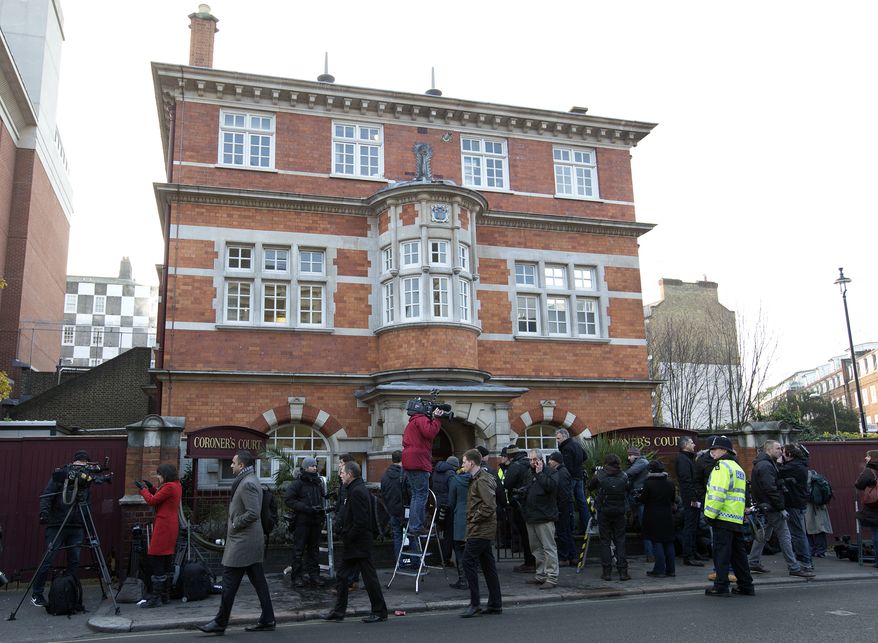 The media gather outside Westminster Coroner's Court in London, where the initial inquest into nurse Jacintha Saldanha's death was opened on Thursday, Dec. 13, 2012. (AP Photo/Alastair Grant)
