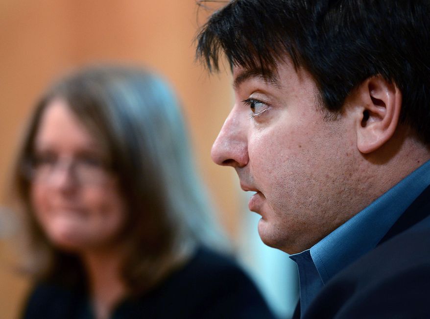 In this Nov. 21, 2012, photo, attorney, Mark Chalos, right, sits with Melanie Norwood, rear left, as they talk about the condition of Norwood's mother, Marjorie Norwood, in Nashville, Tenn. Marjorie Norwood, 59, became sick with fungal meningitis after getting steroid shots produced by the New England Compounding Center. (AP Photo/Mark Zaleski)