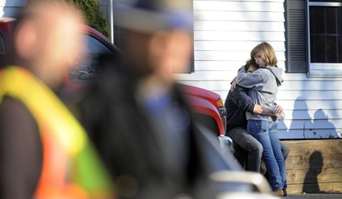 People embrace at a firehouse staging area for family around near the scene of a shooting at the Sandy Hook Elementary School in Newtown, Conn., about 60 miles (96 kilometers) northeast of New York City, Friday, Dec. 14, 2012. An official with knowledge of Friday&#x27;s shooting said 27 people were dead, including 18 children.  (AP Photo/Jessica Hill)