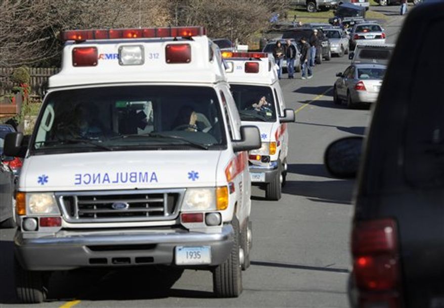 Ambulances leave an area near the scene of a shooting at the Sandy Hook Elementary School in Newtown, Conn., about 60 miles (96 kilometers) northeast of New York City, Friday, Dec. 14, 2012. An official with knowledge of Friday's shooting said 27 people were dead, including 18 children. (AP Photo/Jessica Hill)