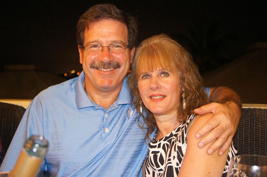 School psychologist Mary Sherlach, who was killed on Friday, Dec. 14, 2012, when a gunman opened fire at Sandy Hook Elementary School in Newtown, Conn., is pictured with her husband, Mark. (AP Photo/Courtesy of Mark Sherlach)