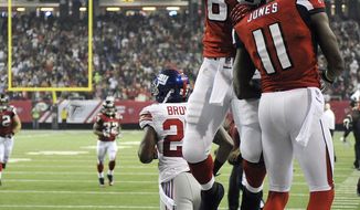 Atlanta Falcons tight end Tony Gonzalez (88) celebrates with wide receiver Julio Jones (11) after Jones scored a touchdown during the second half of an NFL football game against the New York Giants, Sunday, Dec. 16, 2012, in Atlanta. (AP Photo/Rich Addicks)