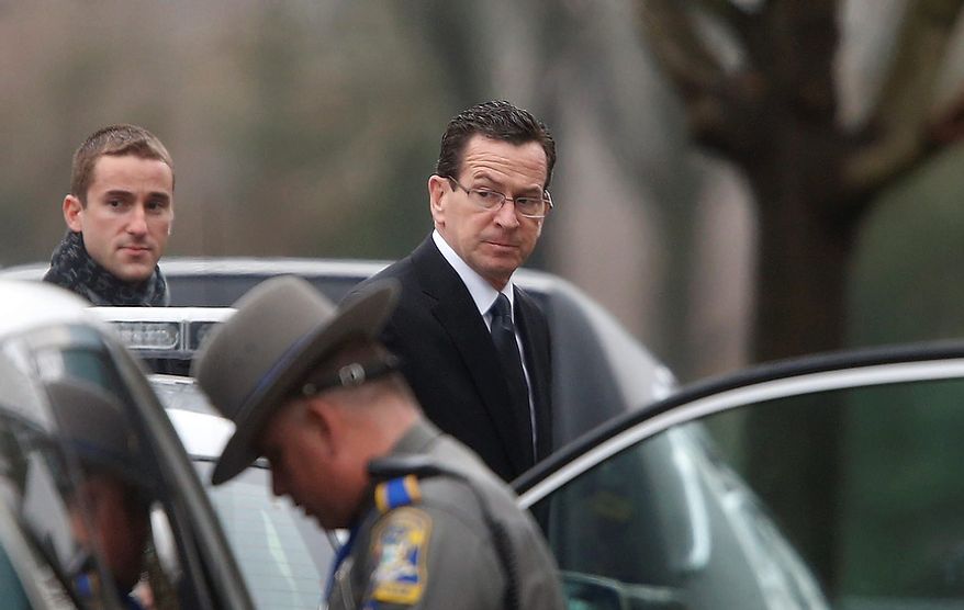 Connecticut Gov. Dannel Malloy arrives at a funeral service for 6-year-old Noah Pozner, Monday, Dec. 17, 2012, in Fairfield, Conn. Pozner was killed when a gunman walked into Sandy Hook Elementary School in Newtown Friday and opened fire, killing 26 people, including 20 children. (AP Photo/Jason DeCrow)