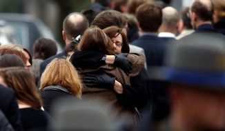 Mourners arrive at a funeral service for 6-year-old Noah Pozner, Monday, Dec. 17, 2012, in Fairfield, Conn.  Pozner was killed when a gunman walked into Sandy Hook Elementary School in Newtown Friday and opened fire, killing 26 people, including 20 children. (AP Photo/Jason DeCrow)