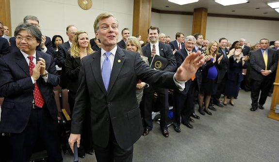 Virginia Gov. Bob McDonnell waves to legislators after he addressed a joint meeting of the House Appropriations and Senate Finance committees at the Capitol Monday, Dec. 17, 2012 in Richmond, Va. McDonnell delivered his 2013 budget reccomendations to the committees. (AP Photo/Steve Helber)