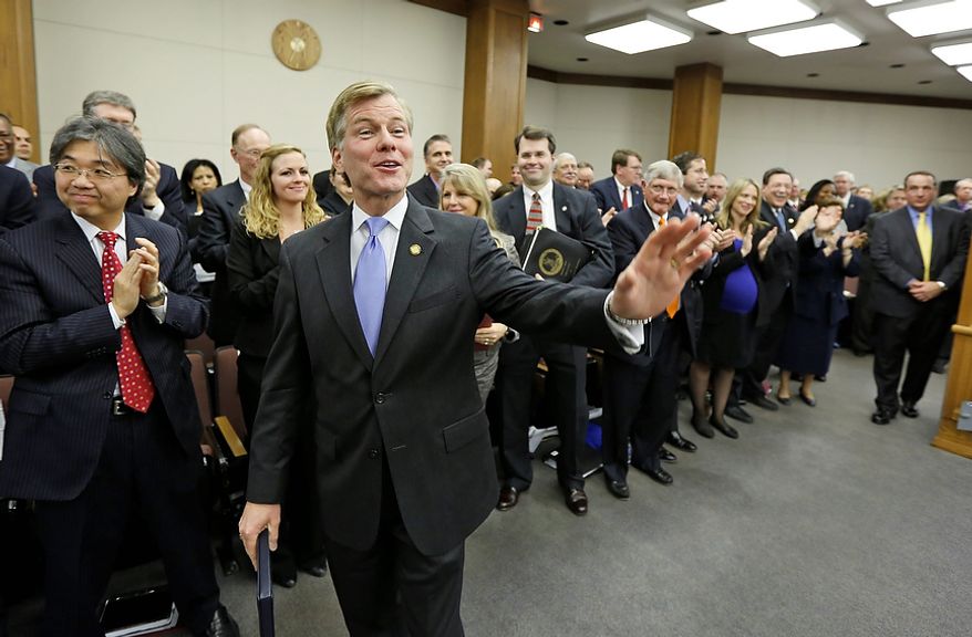 Virginia Gov. Bob McDonnell waves to legislators after he addressed a joint meeting of the House Appropriations and Senate Finance committees at the Capitol Monday, Dec. 17, 2012 in Richmond, Va. McDonnell delivered his 2013 budget reccomendations to the committees. (AP Photo/Steve Helber)