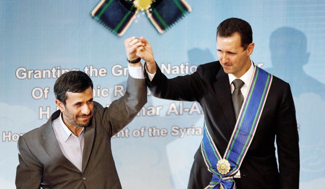 Iran seems to understand it cannot hang its entire strategy on the survival of Syrian President Bashar Assad (wearing sash next to Iranian President Mahmoud Ahmadinejad) and needs to build new alliances as contingencies. Iran has proposed a plan for elections in Syria for parliament and president. (Associated Press)