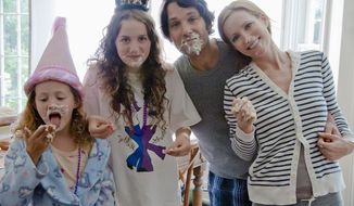 Reprising their roles from “Knocked Up,” (from left) Iris Apatow, Maude Apatow, Paul Rudd and Leslie Mann star in the comedy “This Is 40.” It is the fourth feature film from writer-director Judd Apatow. (Universal Pictures)