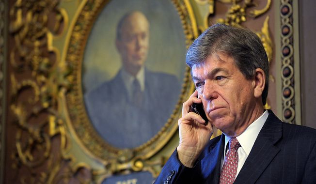 Sen. Roy Blunt, R-Mo., talks on the phone on Capitol Hill in Washington, Tuesday, Dec. 18, 2012. (AP Photo/Susan Walsh)