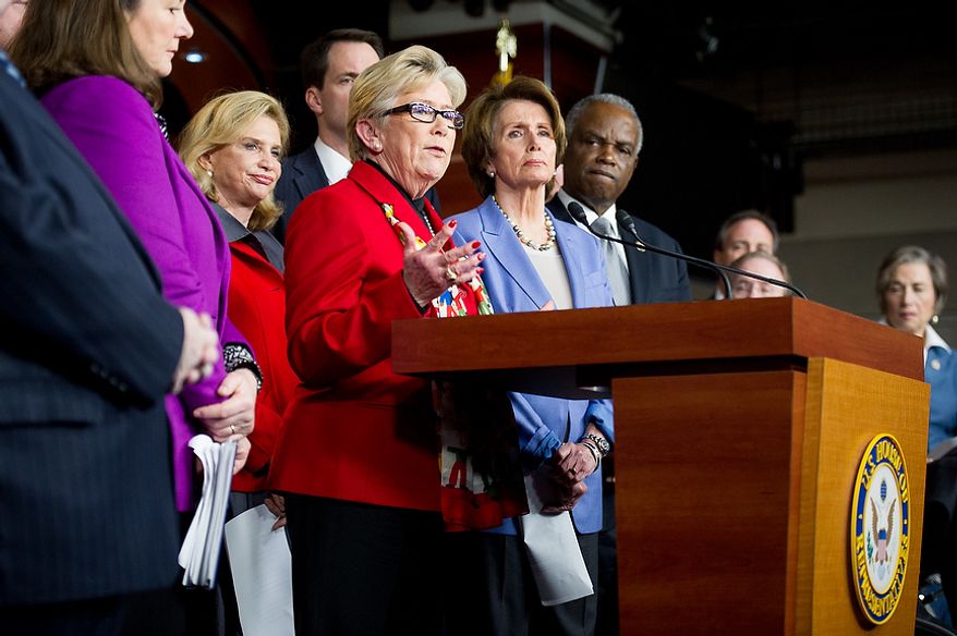 Carolyn McCarthy (D-N.Y.) is surrounded by her fellow House Democrats as she speaks at a news conference calling for a ban on high capacity ammunition clips following the Newtown, Conn., shooting massacre, in the House Visitors Center on Capitol Hill, Washington, D.C., Wednesday, December 19, 2012. Rep. McCarthy's husband was killed and her son severely injured in a Long Island Rail Road commuter train shooting spree in 1993. (Andrew Harnik/The Washington Times)