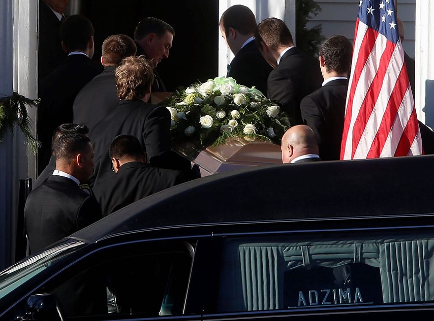 A coffin bearing the body of Victoria Soto is carried into Lordship Community Church before her funeral service, Wednesday, Dec. 19, 2012, in Stratford, Conn. Soto was killed when a gunman forced his way into Sandy Hook Elementary School in Newtown, Dec. 14, and opened fire, killing 26 people, including 20 children. (AP Photo/Jason DeCrow)