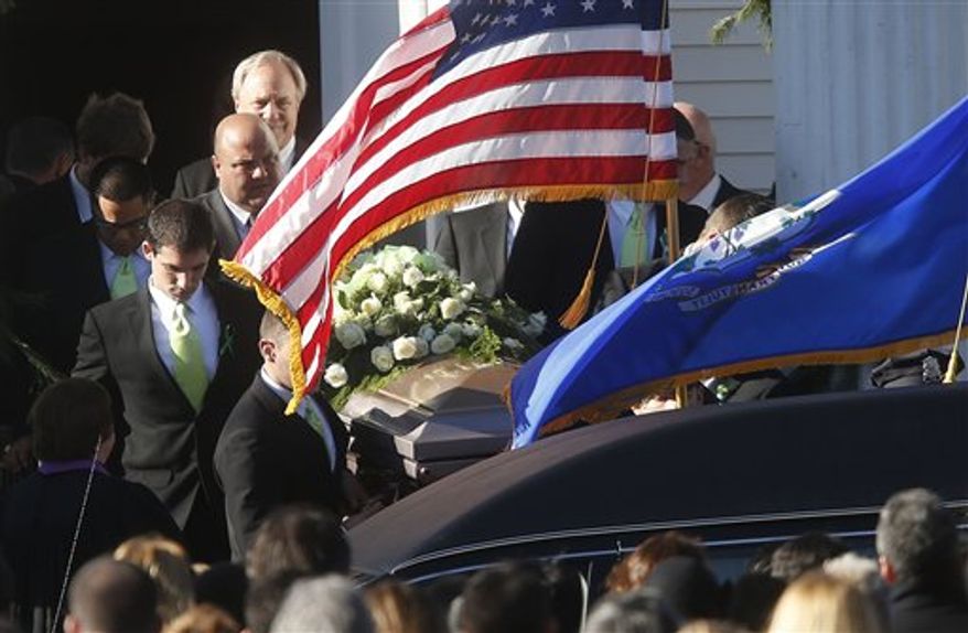 A coffin bearing the body of Victoria Soto is carried out of Lordship Community Church after her funeral service, Wednesday, Dec. 19, 2012, in Stratford, Conn. Soto was killed when Adam Lanza walked into Sandy Hook Elementary School in Newtown, Conn., Dec. 14, and opened fire, killing 26 people, including 20 children, before killing himself.(AP Photo/Jason DeCrow)
