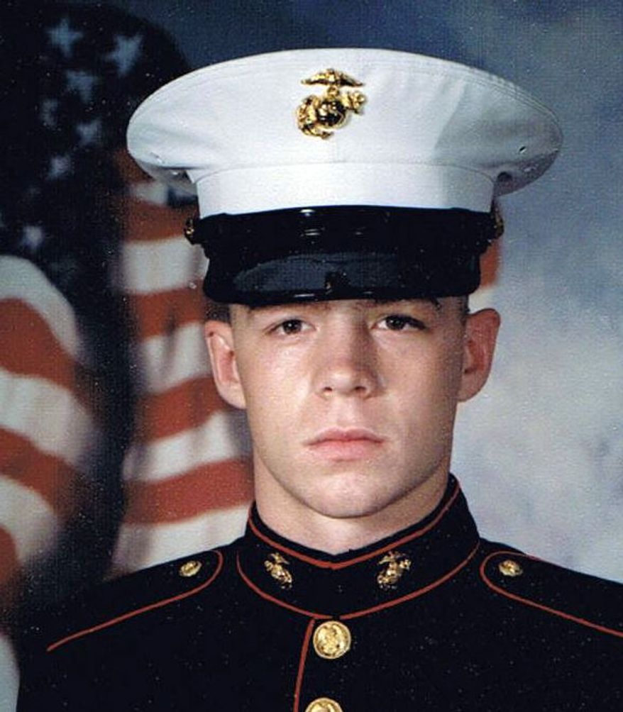 Former Marine Jon Hammar, who served combat tours in Afghanistan and Iraq, was arrested for illegally possessing an antique firearm even though he declared the gun to Mexican Customs agents. He is shown in an official 2003 USMC portrait. He could face up to 15 years in prison if convicted. Photo courtesy Olivia Hammar. (Associatd Press)