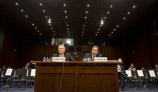 Deputy Secretary of State William J. Burns (left) and Thomas R. Nides, deputy secretary of state for management and resources, speak before the Senate Foreign Relations Committee at a hearing on Thursday, Dec. 20, 2012, on the Benghazi attack. (Barbara L. Salisbury/The Washington Times)
