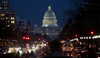 Red lights illuminate Pennsylvania Avenue as the U.S. Capitol glows in the twilight, in Washington, Wednesday, Dec. 19, 2012. (AP Photo/Jacquelyn Martin) ** FILE **