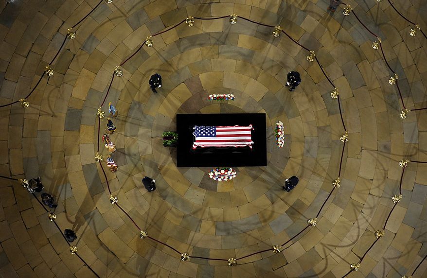 Sen. Daniel Inouye, D-Hawaii, the second-longest-serving senator in history, lies in state in the Capitol Rotunda in Washington, Thursday, Dec. 20, 2012. Inouye was a Medal of Honor recipient who represented his state in the U.S. House and then the Senate, where he served for five decades. He died Monday evening at age 88 of respiratory complications. (AP Photo/Susan Walsh)